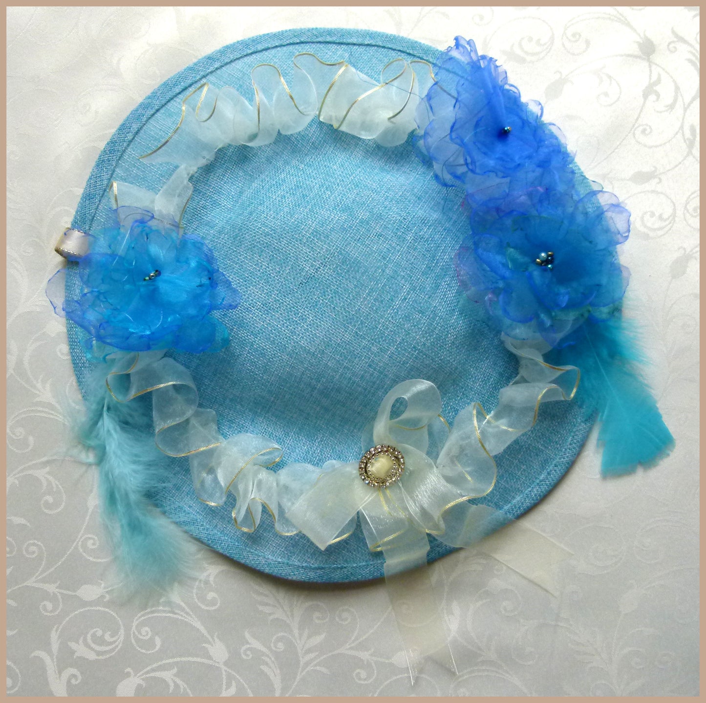 Blue Hat (36cm) with White and Gold Trim, Dark Blue Flowers, Bow and Turquoise Feathers