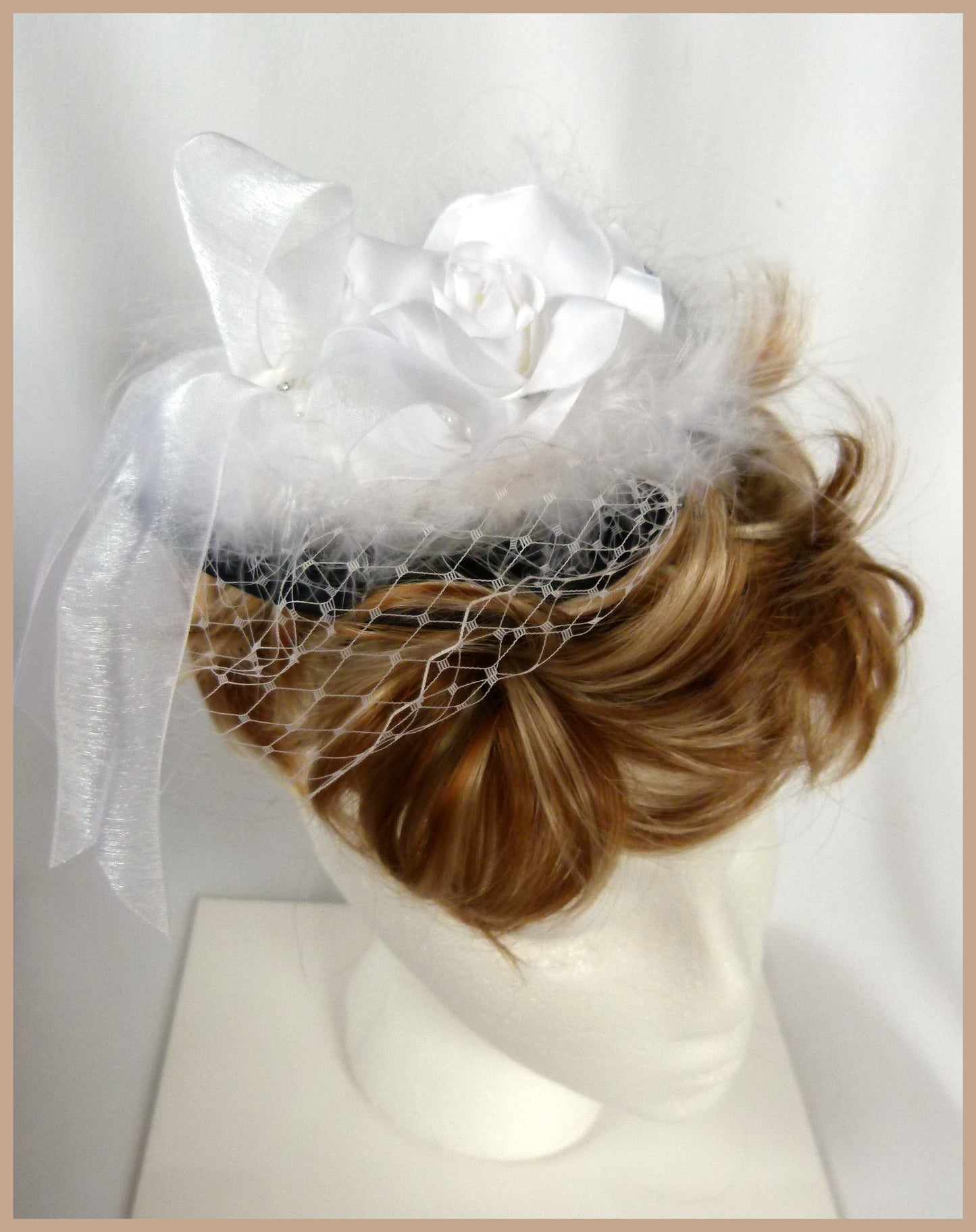 White wedding fascinator with white role, white marabou feathers, white organza ribbon and sparkle brooch and ivory veiling