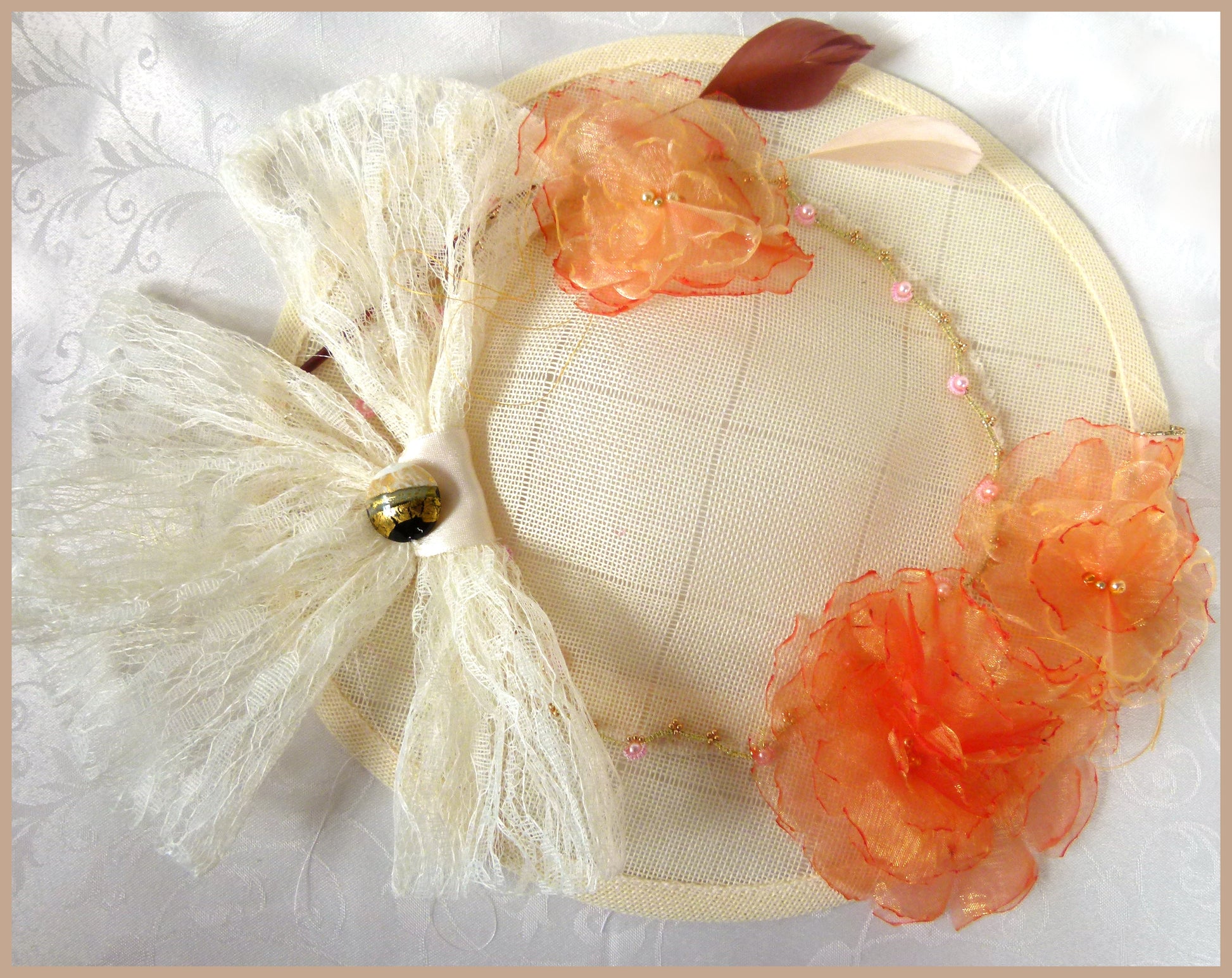 Cream Hatinator with Cream Bow and Button, Orange Flowers, Brown and Beige Feathers and Beaded Tatting